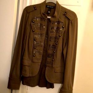 olive knit jacket with matching green camisole.